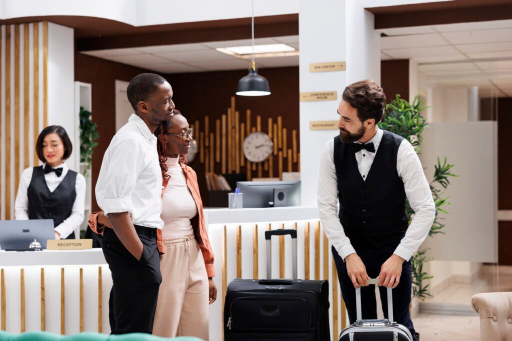 Hotel steward carrying backpack at resort