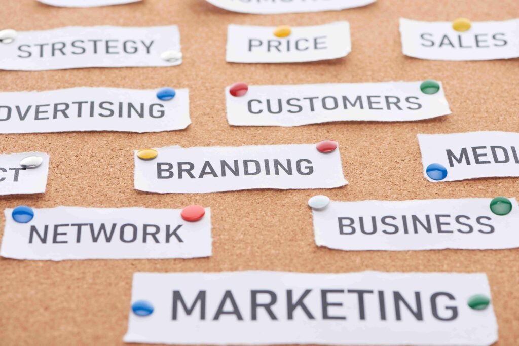 A corkboard displaying key digital marketing concepts