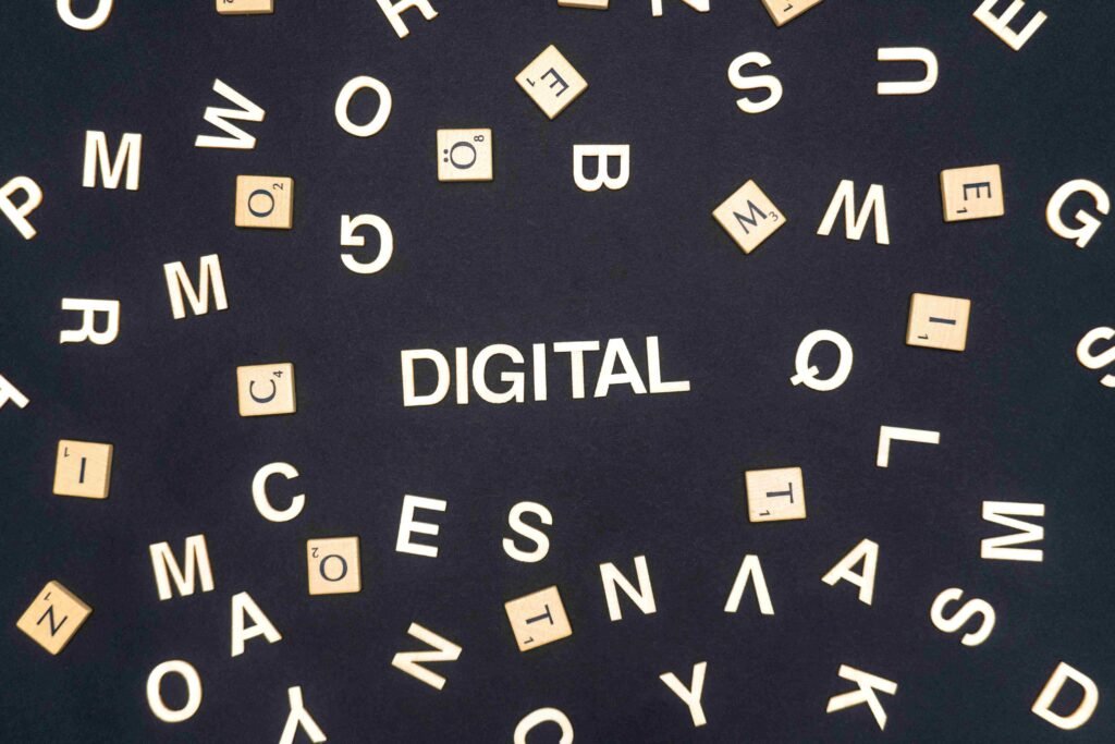 Scattered wooden letters with "DIGITAL" in the center. - Marketing and Digital Marketing Services