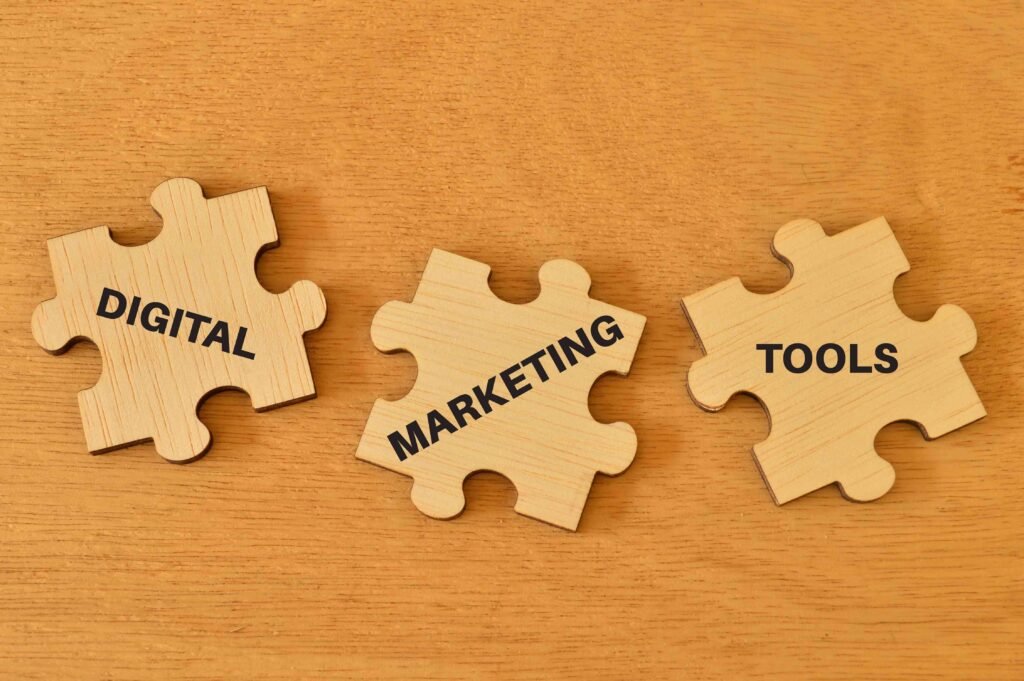Three wooden puzzle pieces with "Digital Marketing Tools." - Marketing and Digital Marketing Services